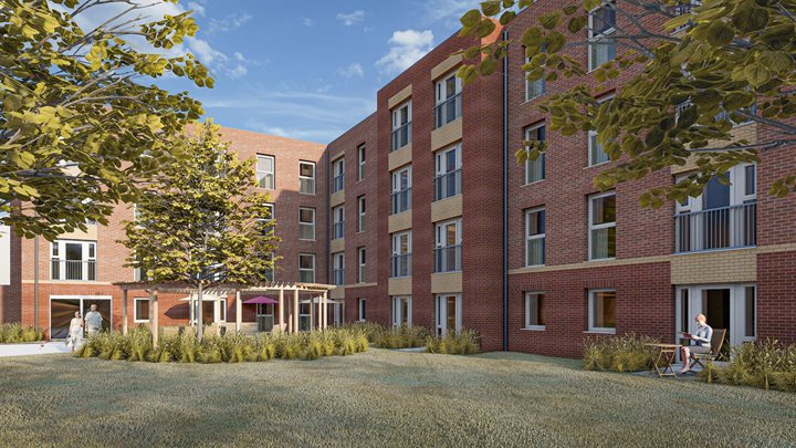 a brick building with a few people sitting outside