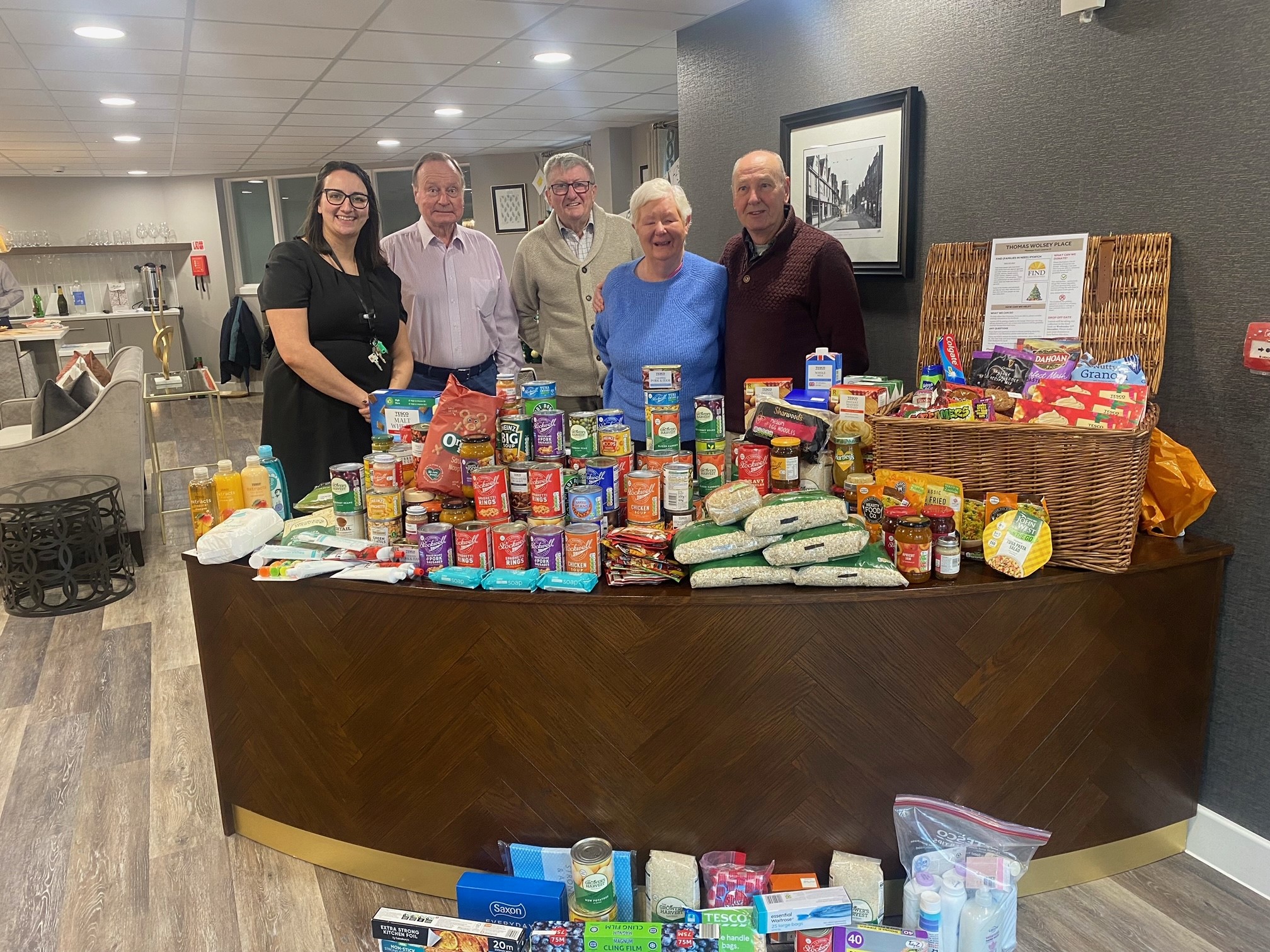 Thomas Wolsey Place Homeowners with their food donation for FIND