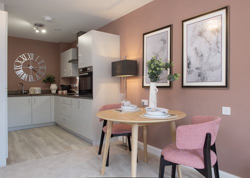 a dining room with a table and chairs