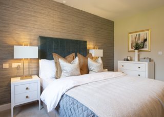 a bed with a white bed spread