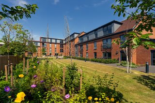 a garden in front of a building