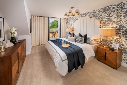 a bedroom with a bed and a table