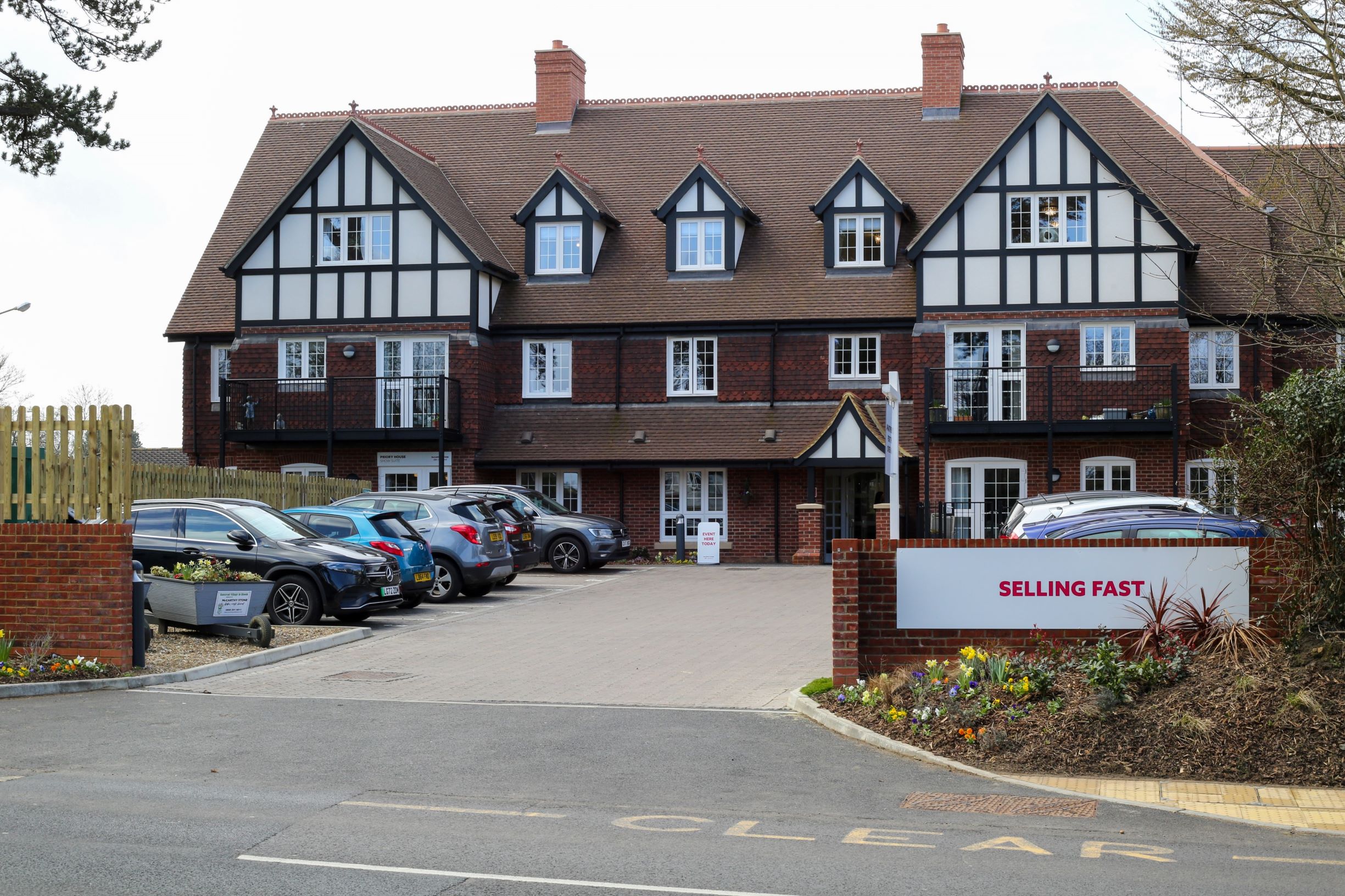 a building with cars parked in front