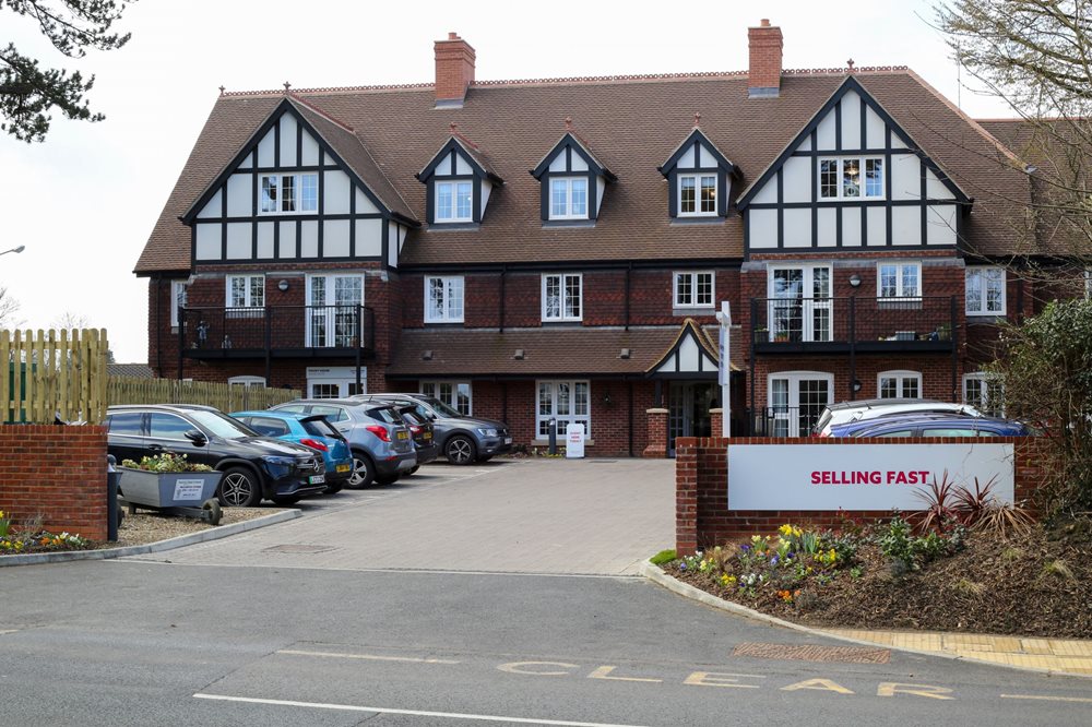 a building with cars parked in front