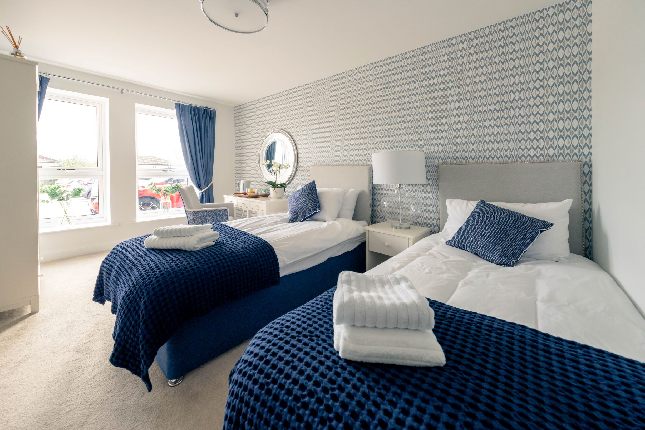 a couple of beds in a room