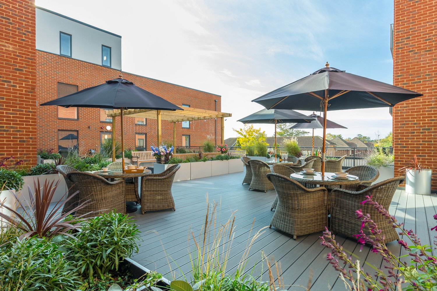 a pool with chairs and umbrellas