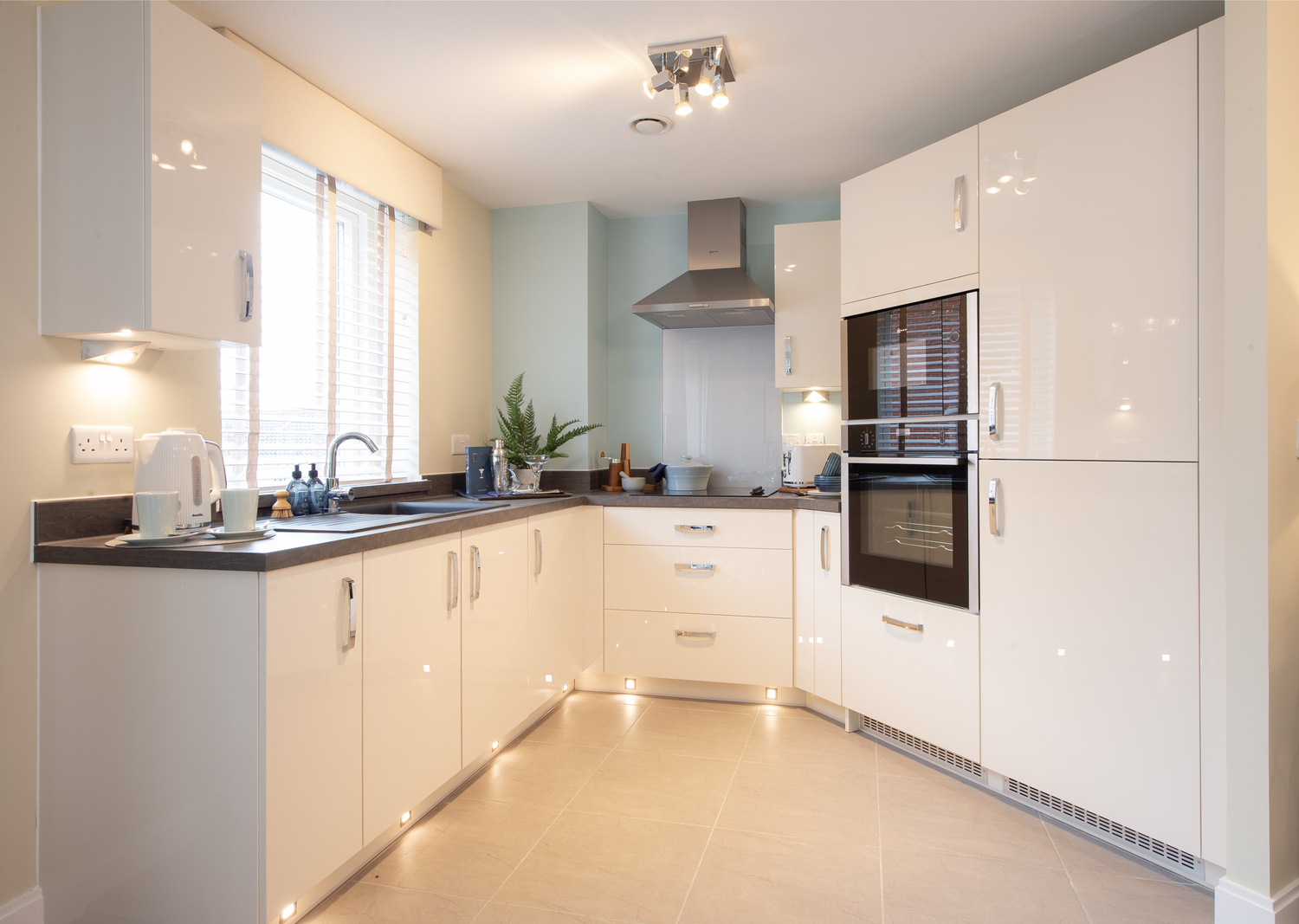 a kitchen with white cabinets