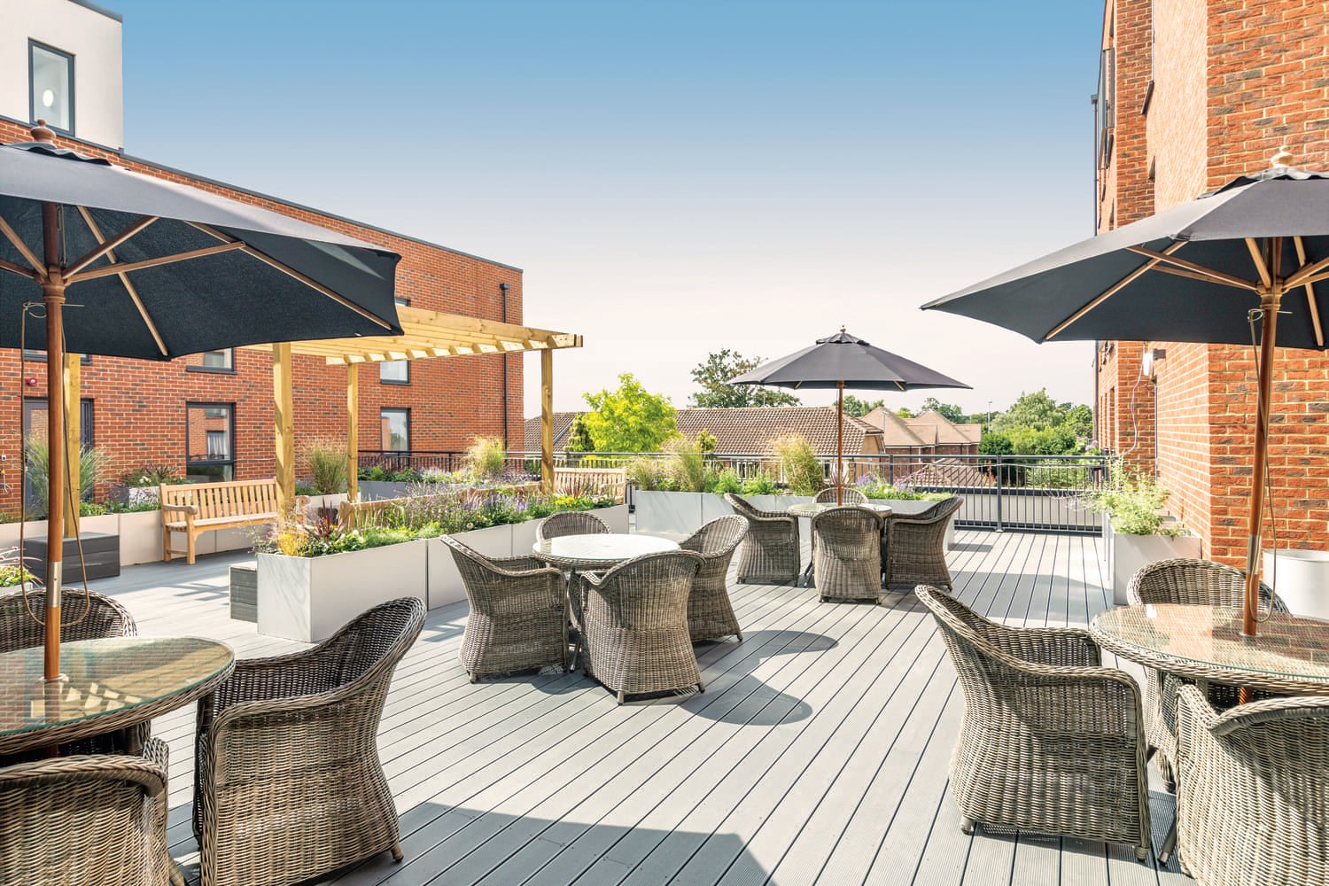 a patio with tables and chairs
