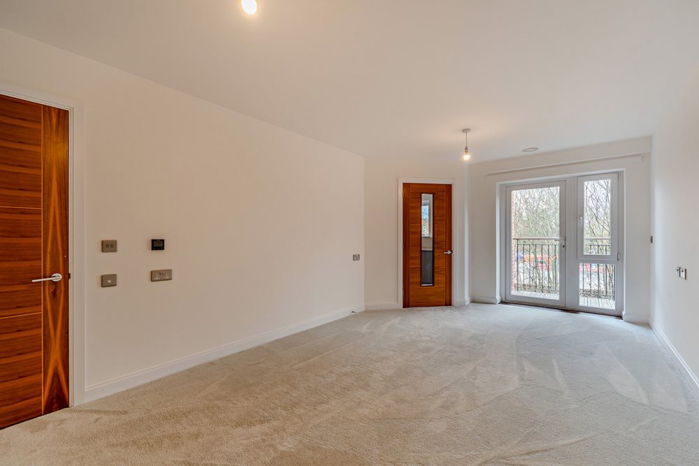 a room with a carpet and a door