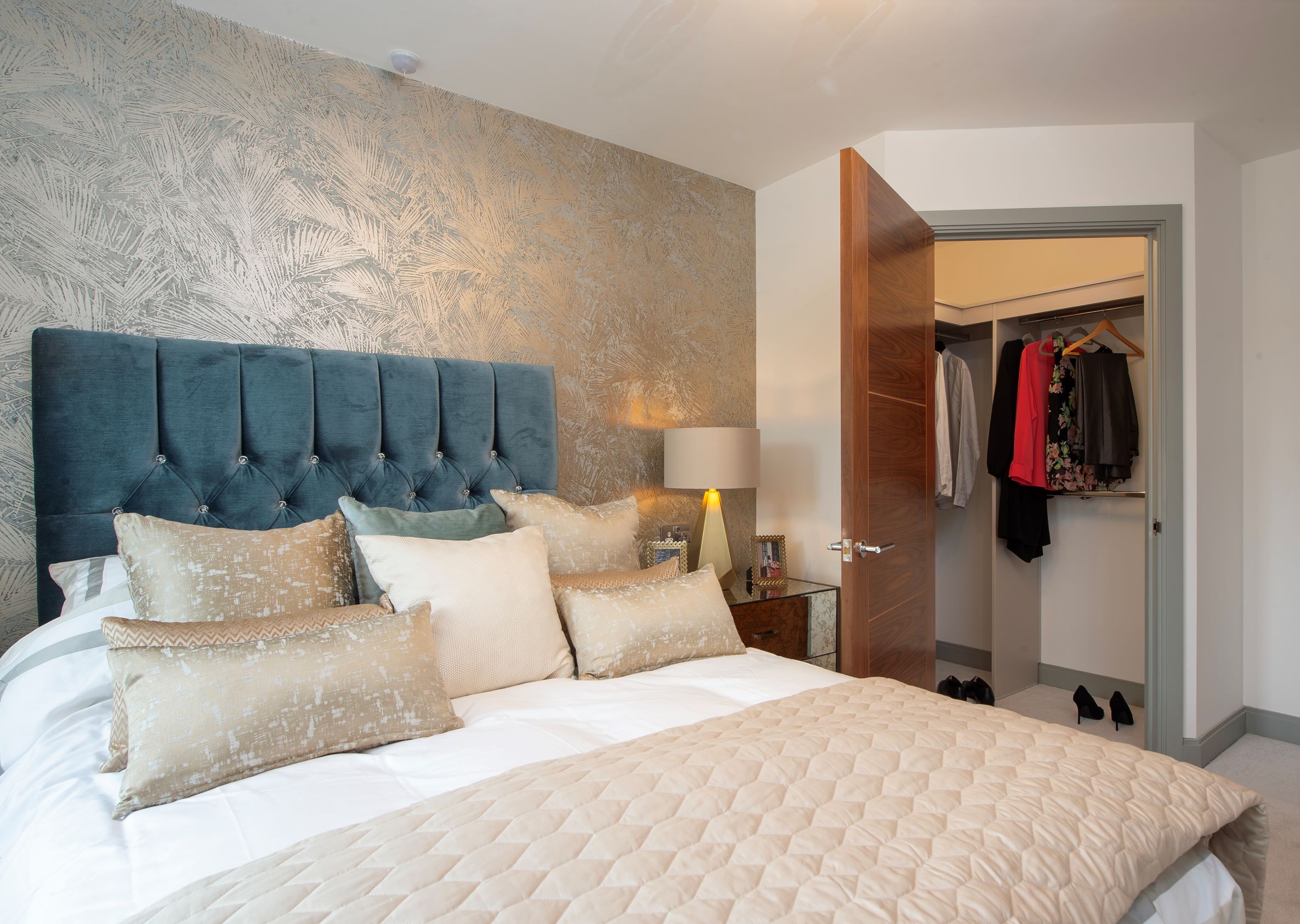 a bedroom with a bed and a closet