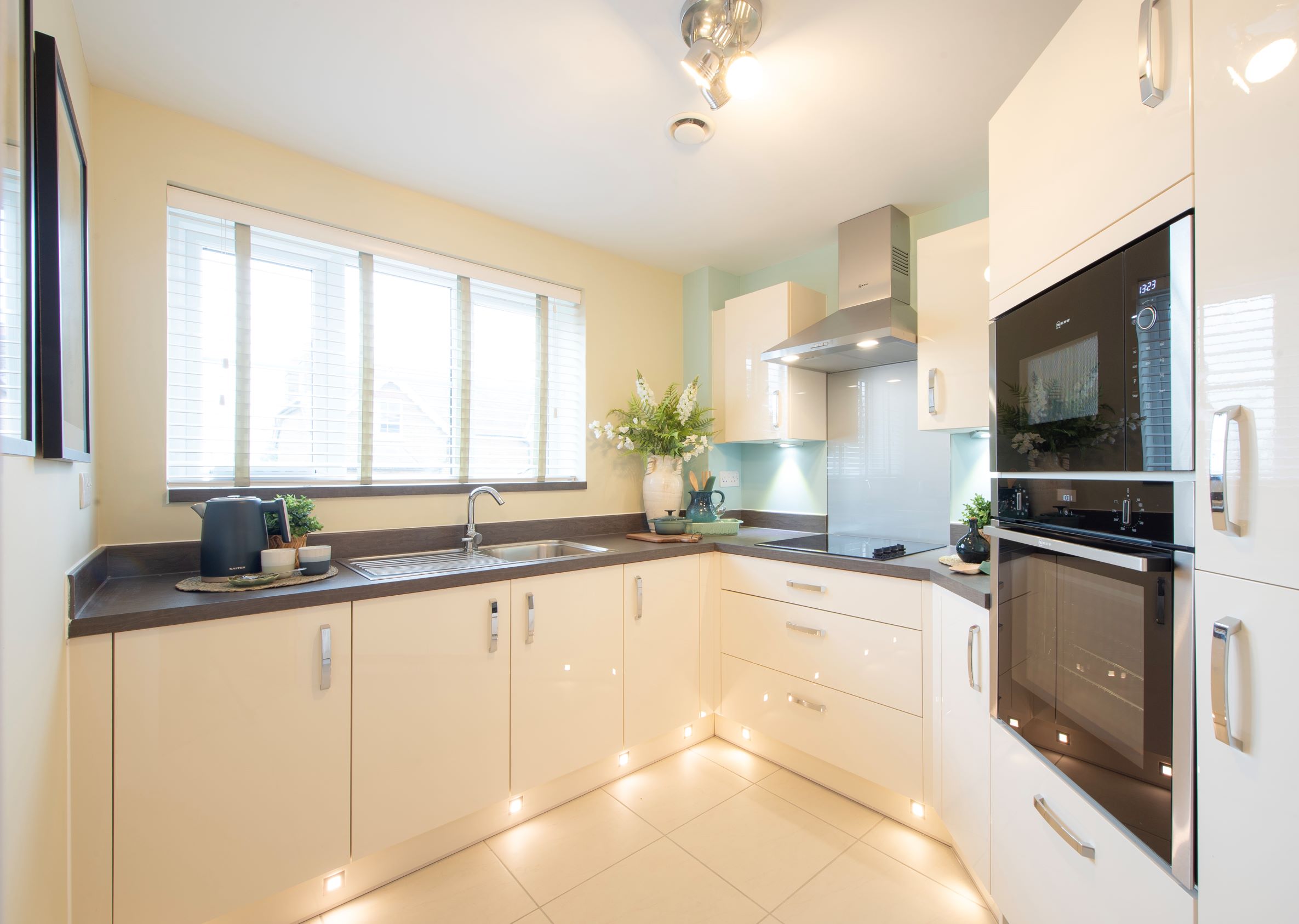 a kitchen with white cabinets