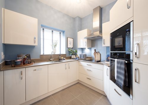 a kitchen with white cabinets
