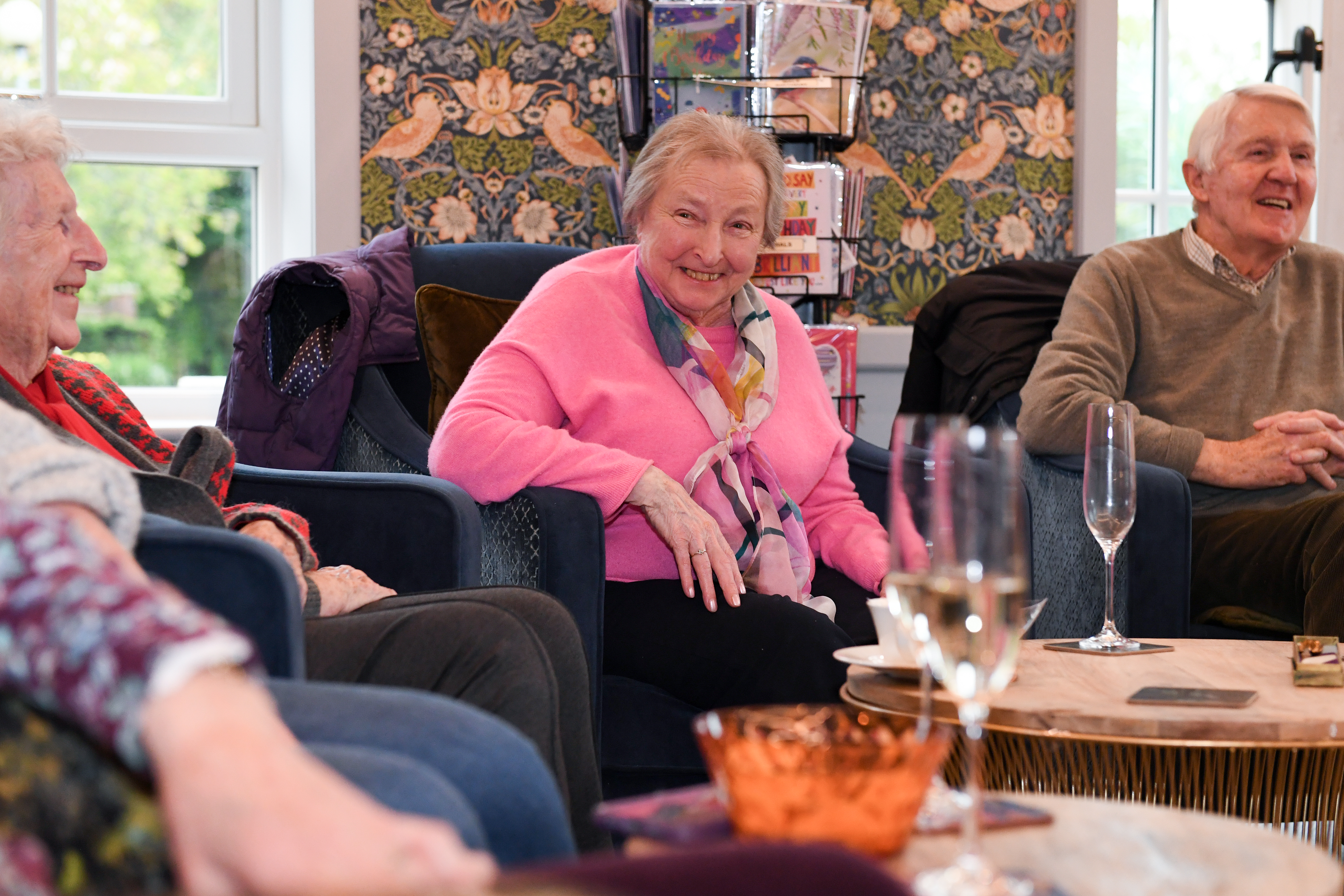 people sat on sofas in conversation