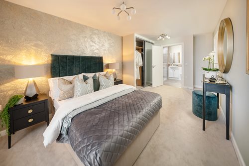 a bedroom with a bed and a mirror