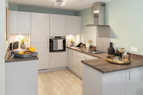 a kitchen with white cabinets