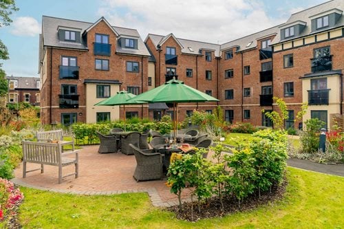 a courtyard with tables and chairs