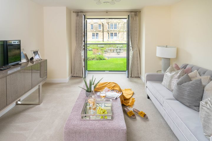 a living room with a tv and couches