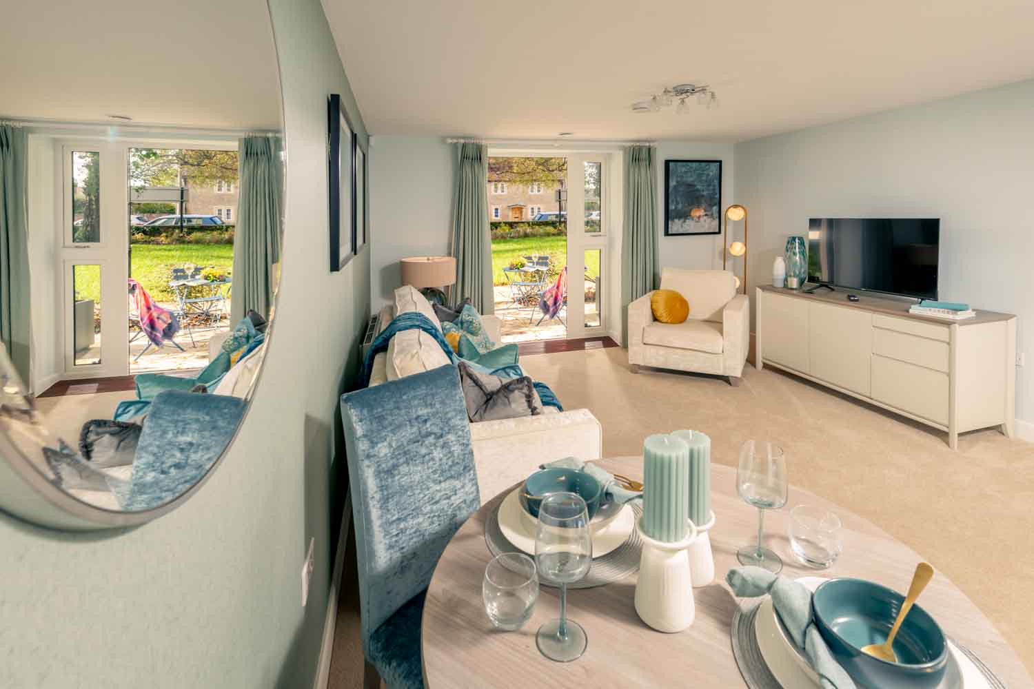 a living room with a table and chairs