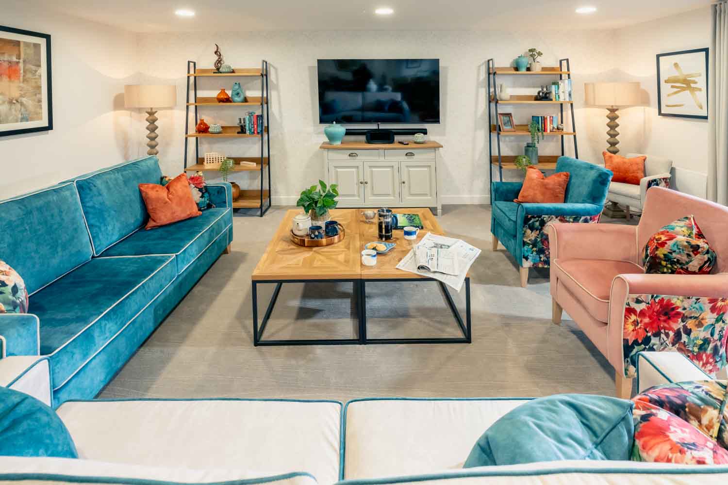 a living room with a blue couch and a coffee table