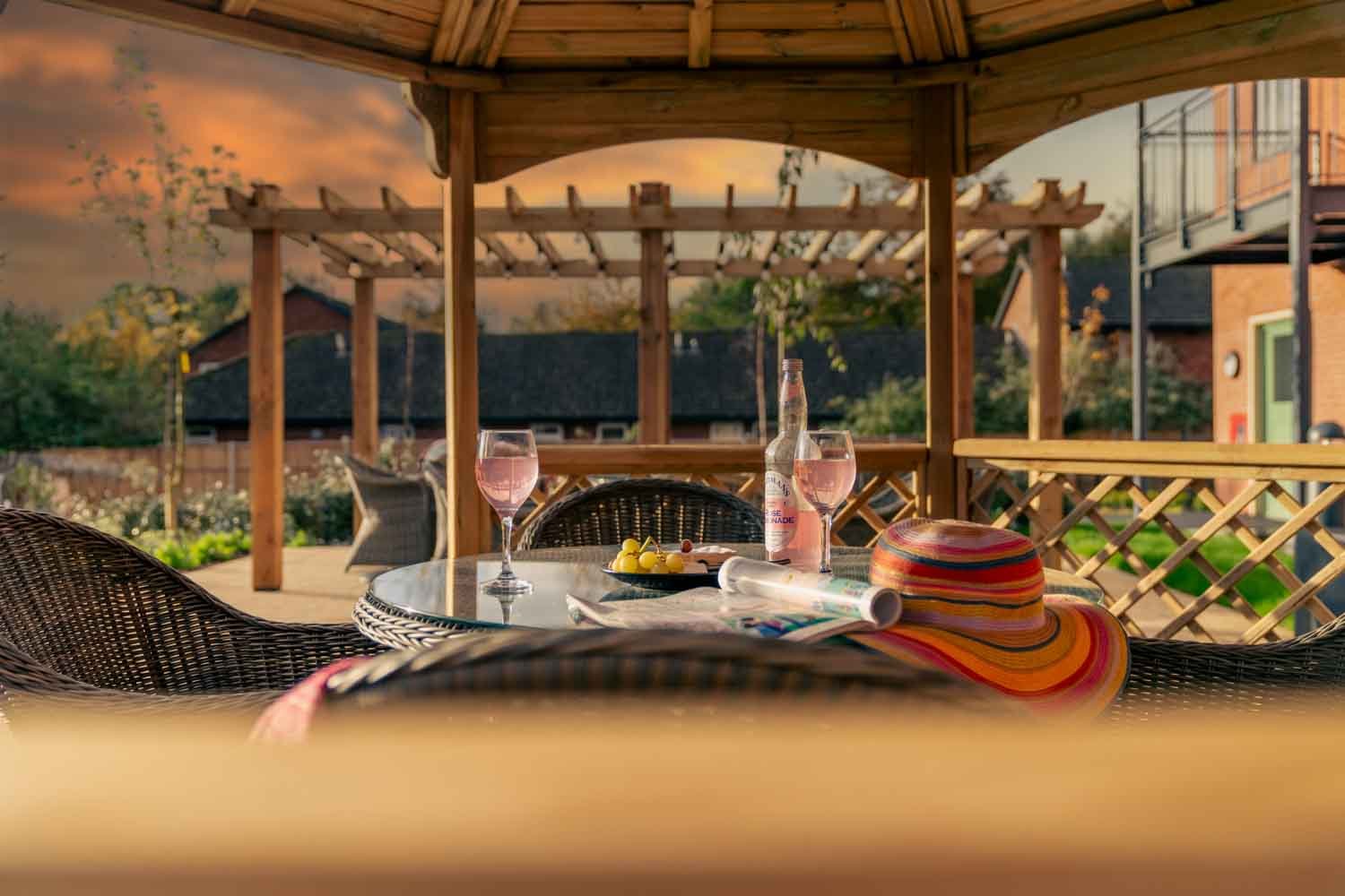 a table with a glass and a plate of food on it