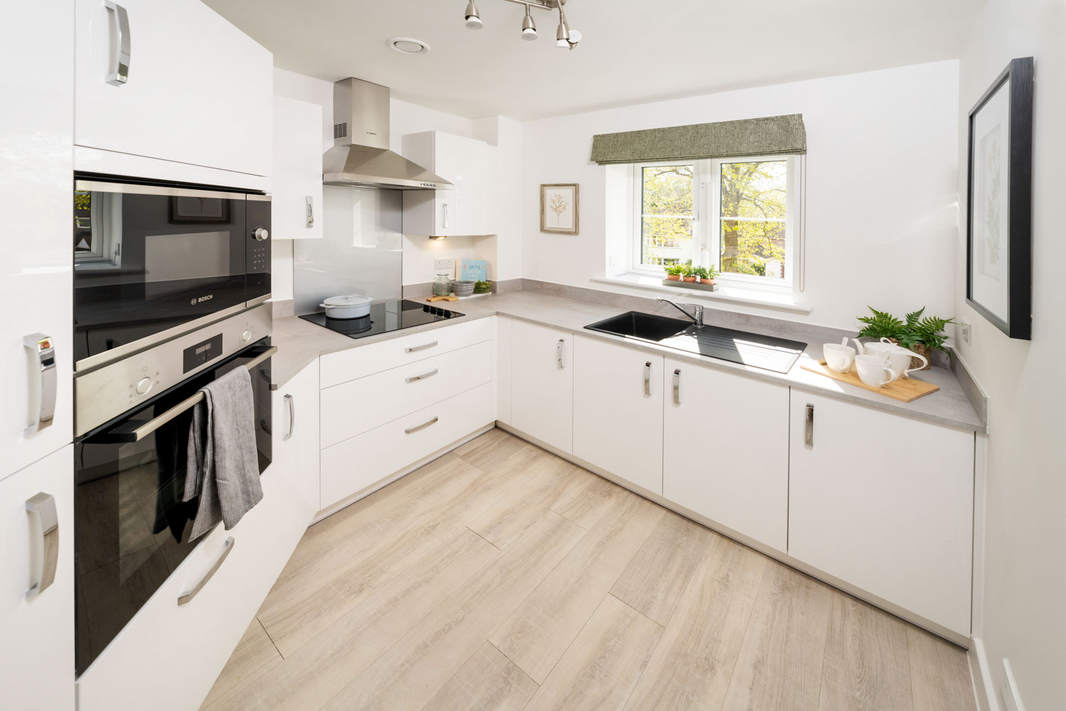 a kitchen with white cabinets