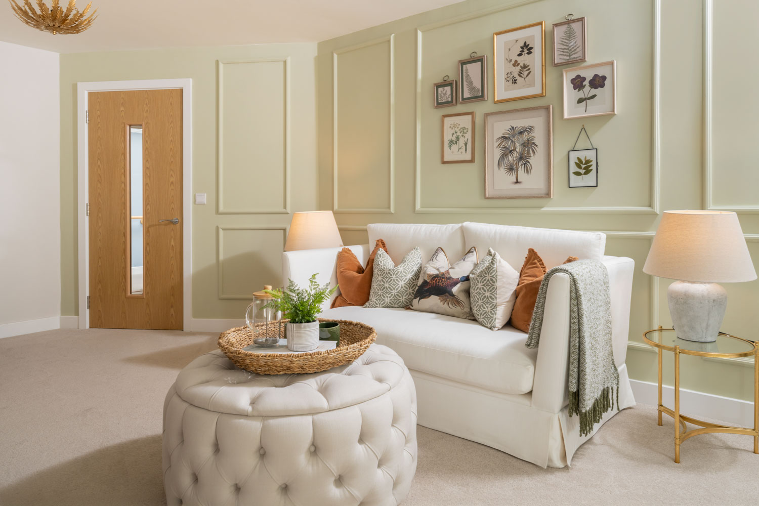 a living room with a white couch and a white chair
