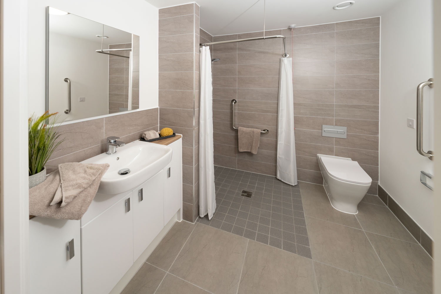 a bathroom with a shower and sink