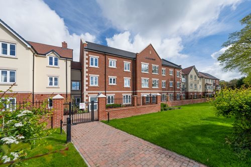 a brick walkway leading to a building