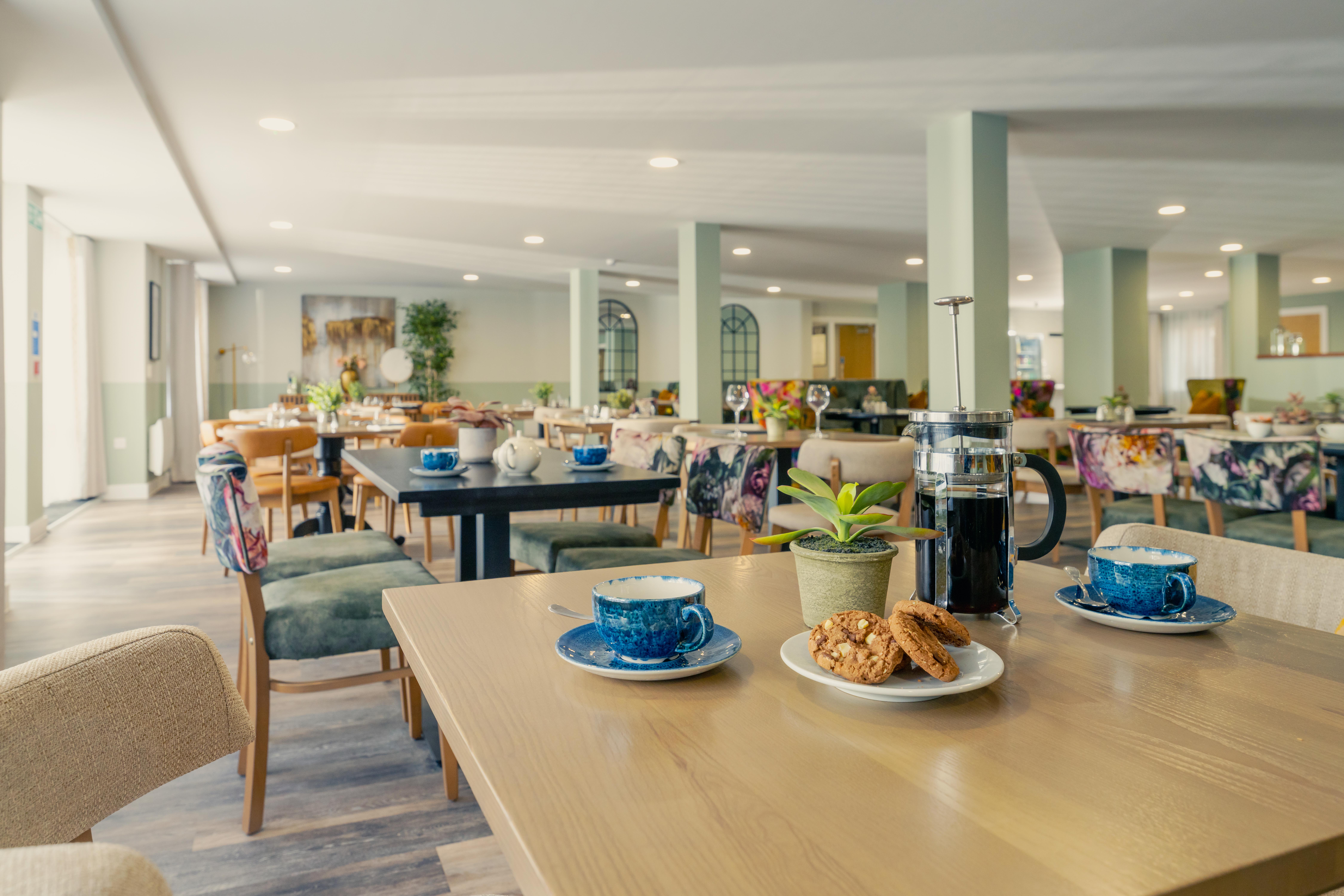 a kitchen with a table and chairs