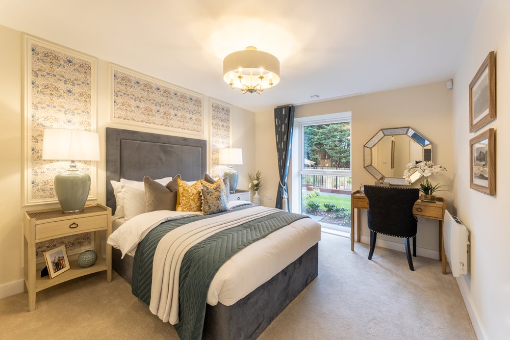 a bedroom with a large mirror