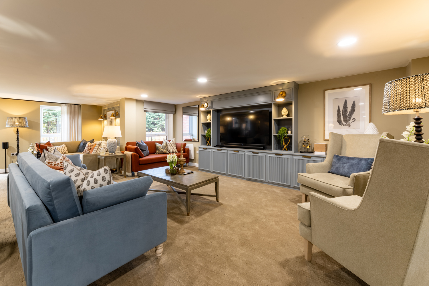 a living room with a tv and couches