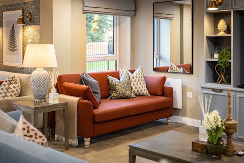 a living room with a red couch