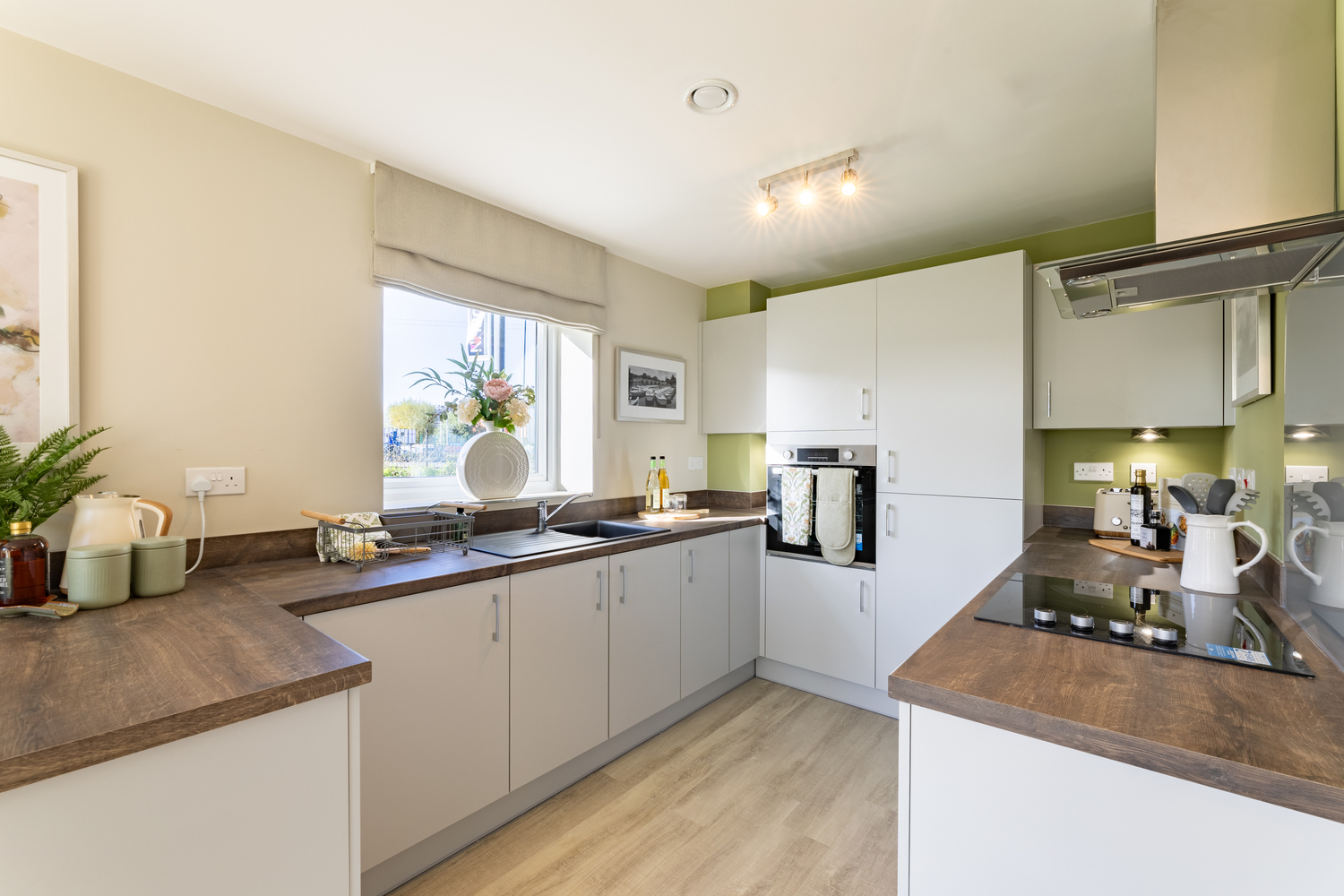 a kitchen with white cabinets