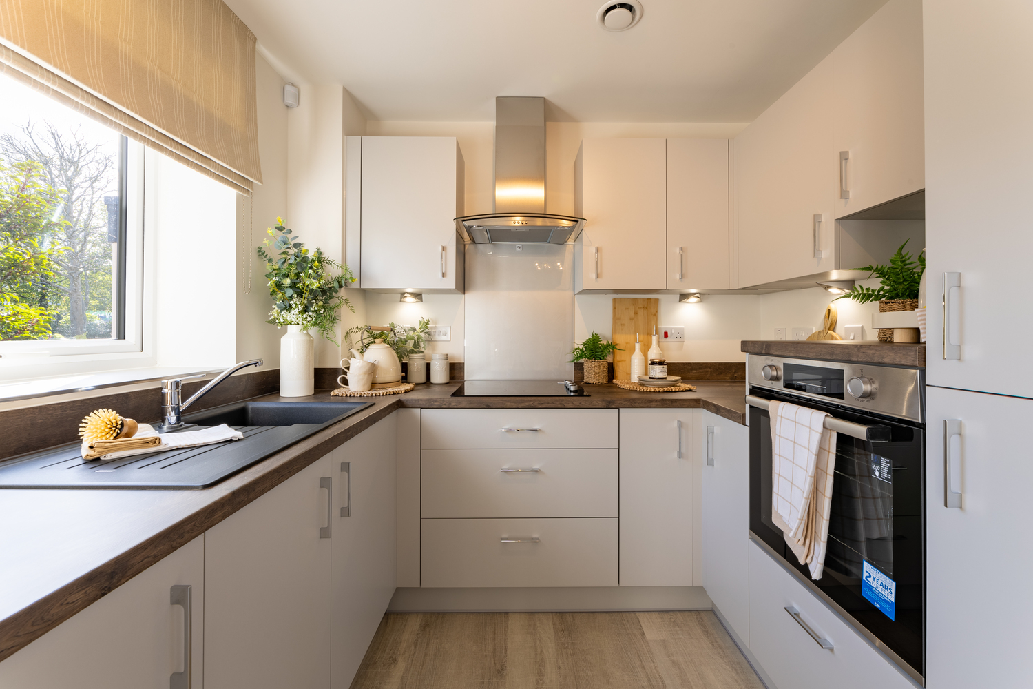 a kitchen with white cabinets