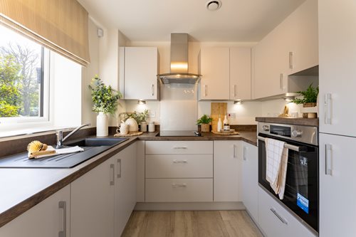 a kitchen with white cabinets