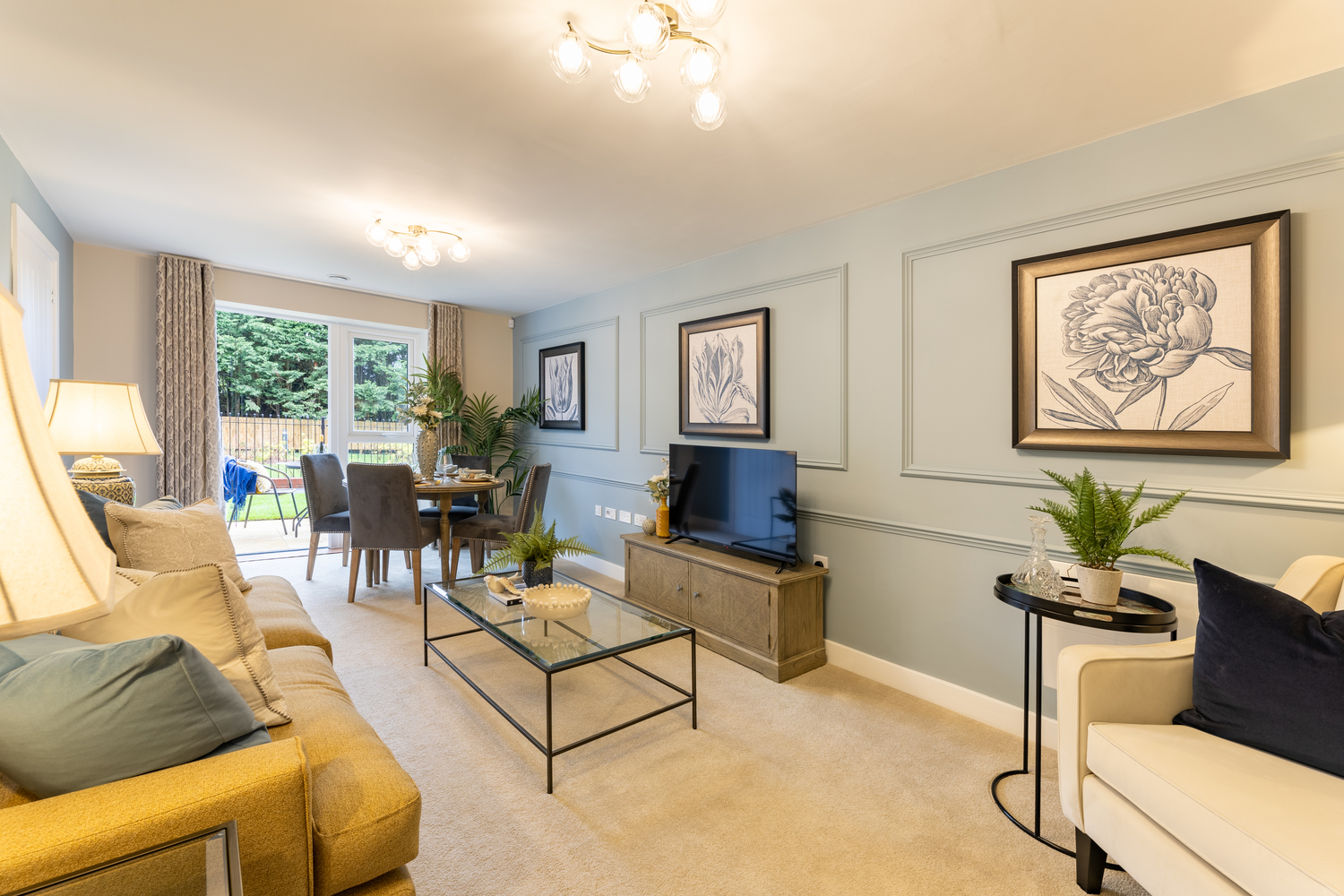 a living room with a tv and couches