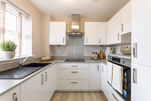 a kitchen with white cabinets