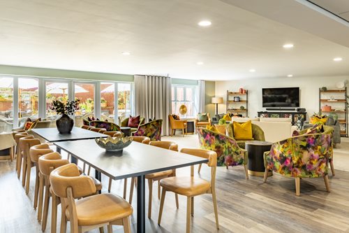 a large room with a table and chairs
