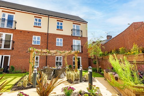 a brick building with a garden