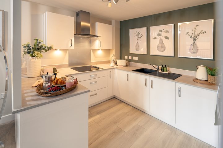 a kitchen with white cabinets