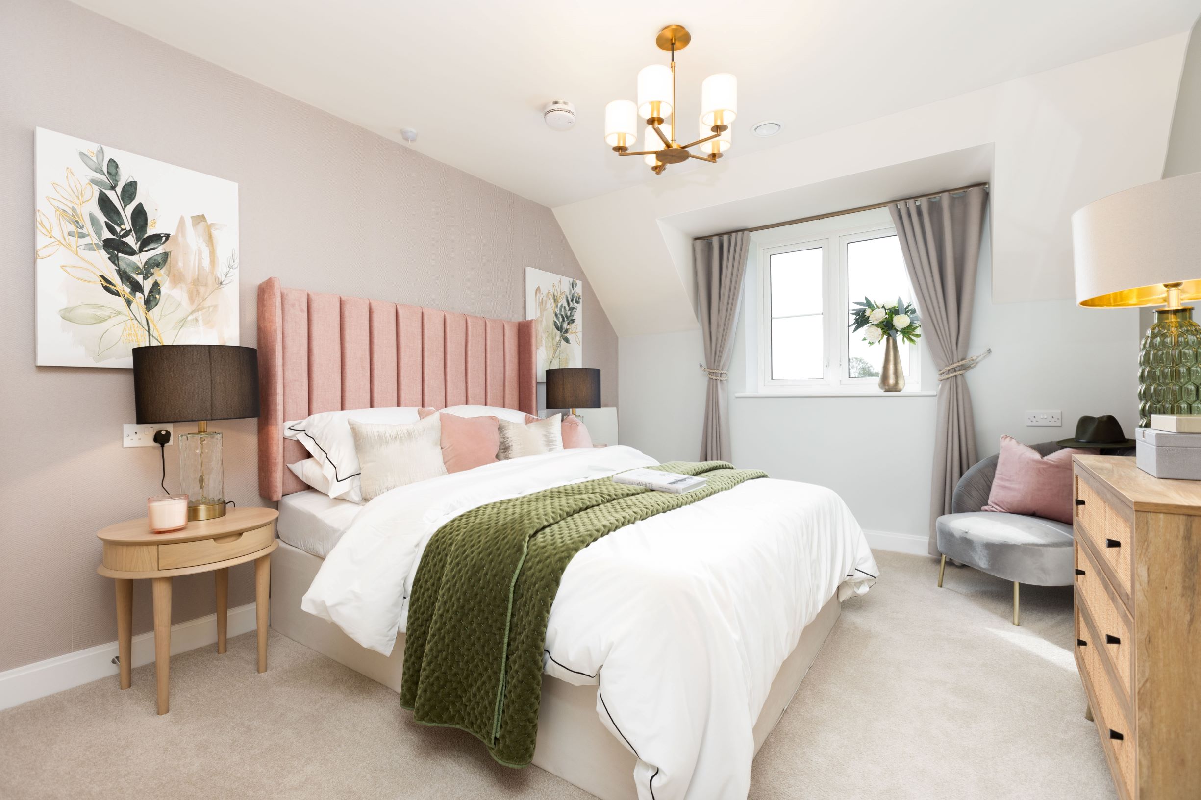a bedroom with a bed and lamps