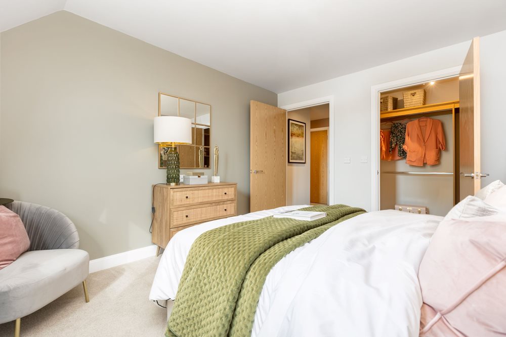 a bedroom with a bed and a lamp