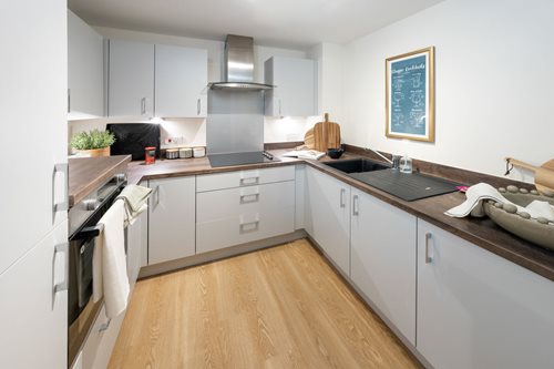 a kitchen with white cabinets