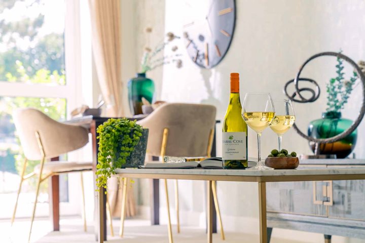 a table with wine bottles and glasses