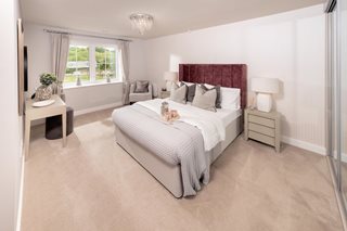 a bedroom with a bed and a chair