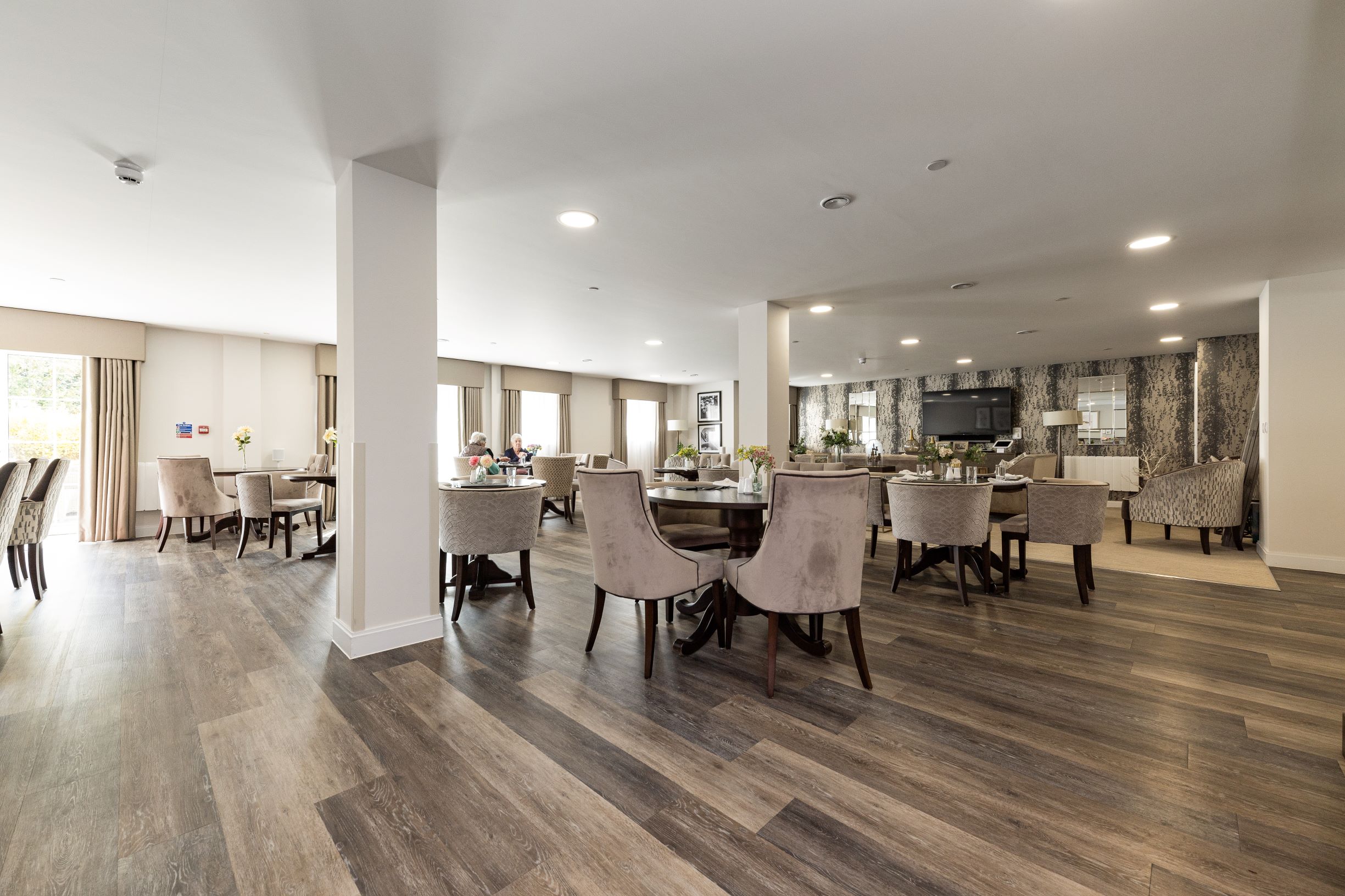 a large room with tables and chairs