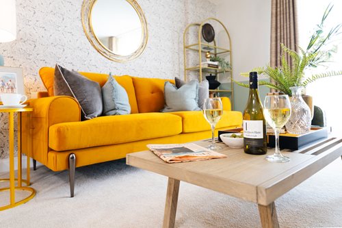 a yellow couch with wine bottles