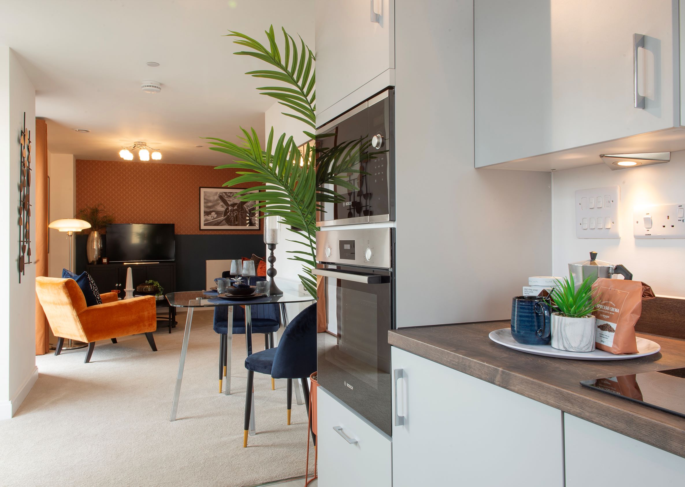 a kitchen with a table and chairs