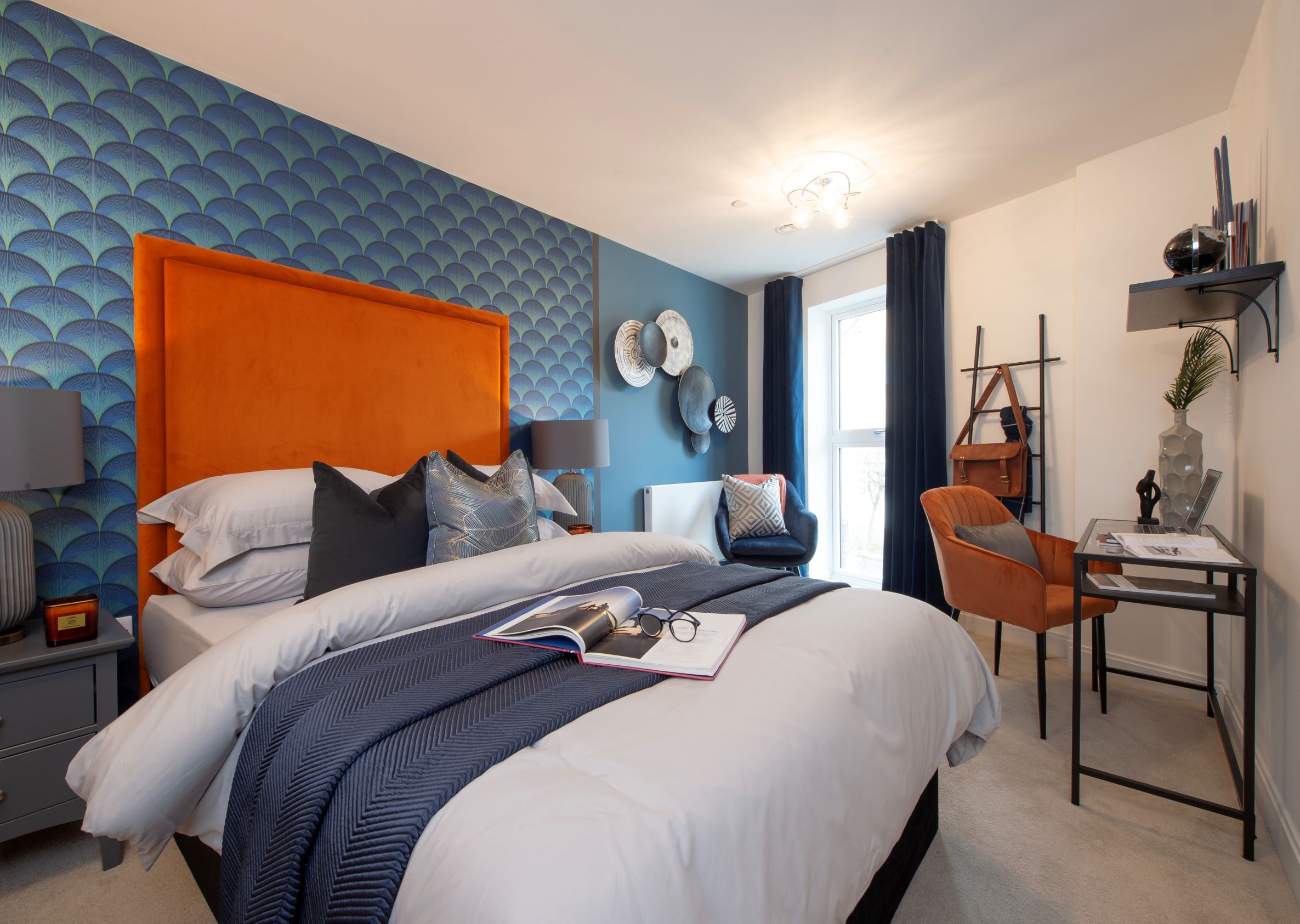 a bedroom with a bed and desk