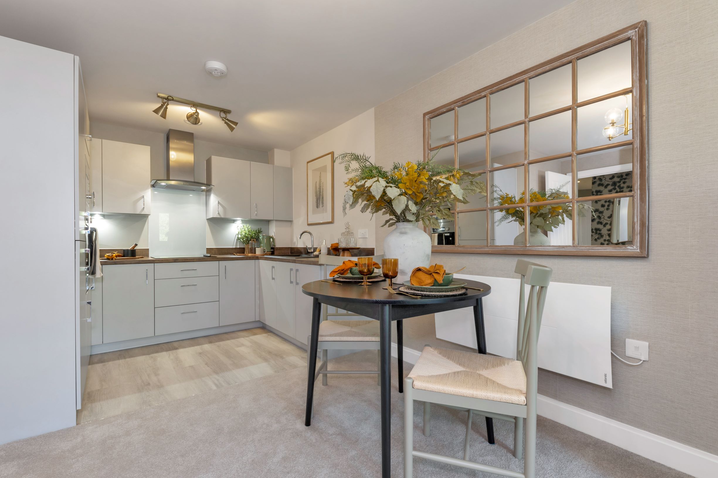 a kitchen with a dining table and chairs